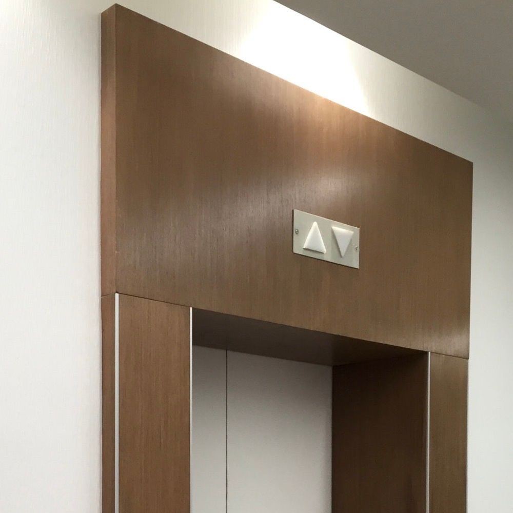 Photography of wooden frame for elevator